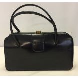 Black leather vintage handbag by Leslie of London with soft leather interior.