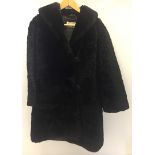 A vintage black fur jacket by Koppens Furs of Westcliffe on Sea. With fabric covered buttons.