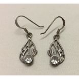 A pair of Art Nouveau design silver earrings set with crystals.