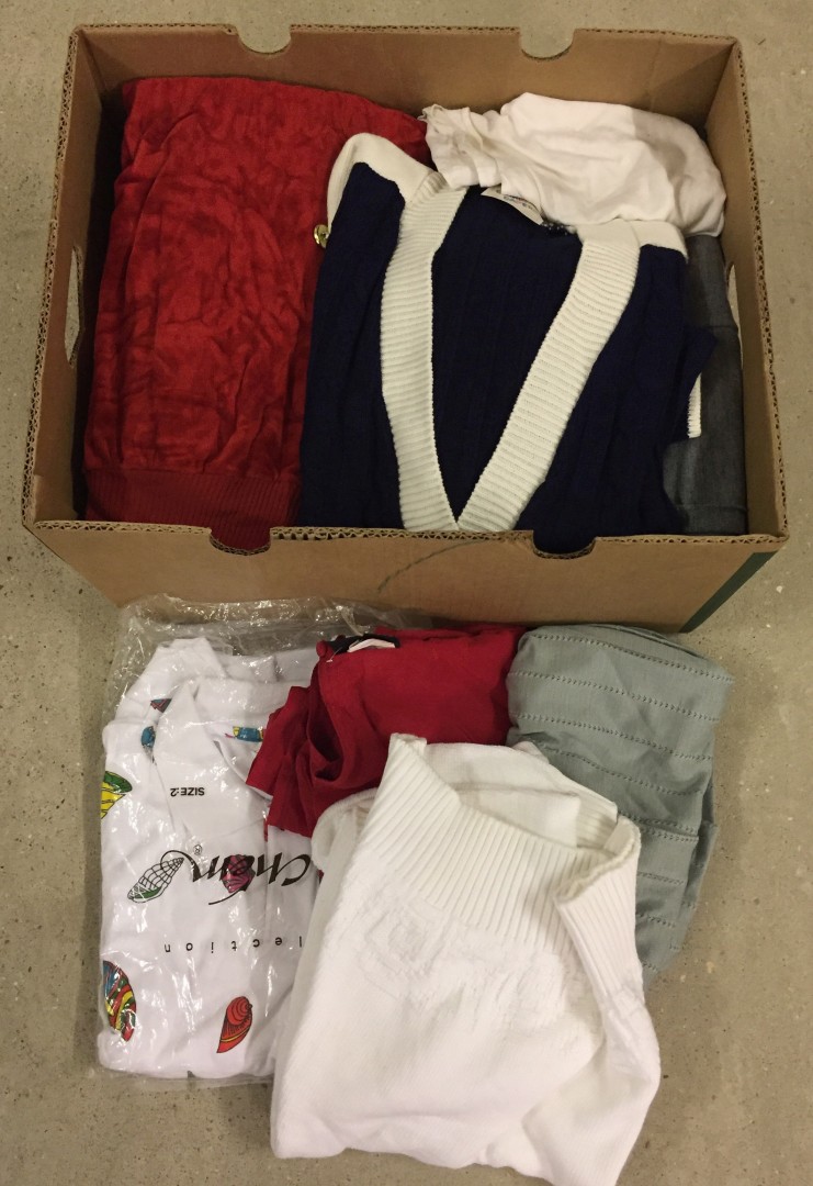 Box of new womens winter jumpers, dresses, trousers, tops and skirts.
