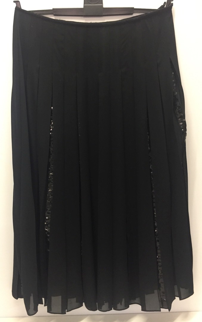 Black pleated chiffon skirt with sequin panels.