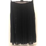 Black pleated chiffon skirt with sequin panels.