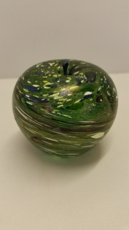 A green glass Ditchfield style apple shaped paperweight.