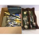 A box of assorted mixed cutlery items together with a wooden cutlery tray.