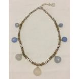 A silver and chalcedony necklace.