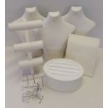 A quantity of white, leather effect and acrylic jewellery display stands.
