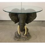 Occasional table with elephants head base.