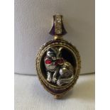 A silver gilt guilloche enamelled cat pendant.