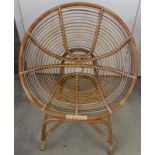 A circular cane armchair