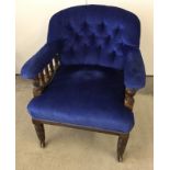 A Victorian library chair with blue upholstery