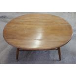 An oval coffee table, possibly Ercol.