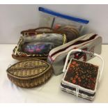 A box of sewing baskets and tapestry items.