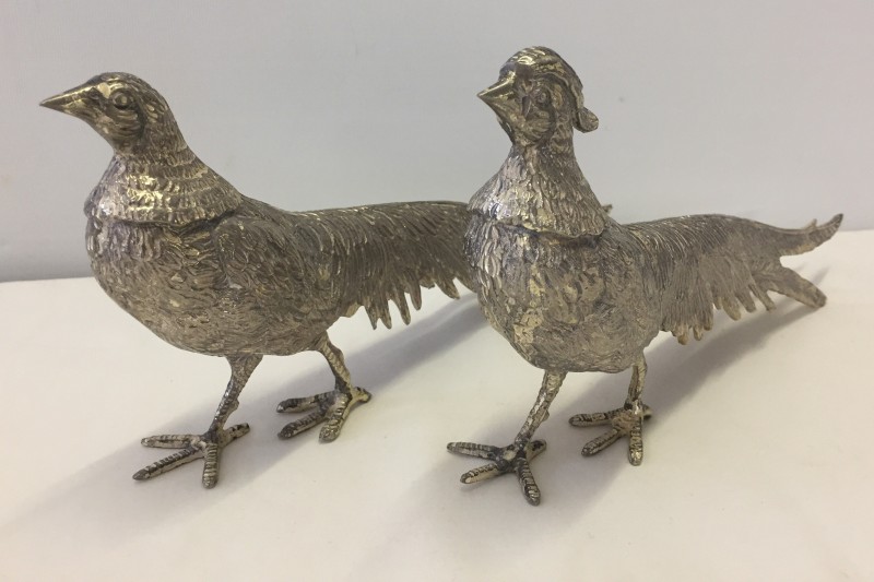 A pair of pewter pheasant figurines.
