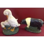 2 painted cast iron doorstops - a pig and 2 geese