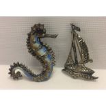 An enamel & marcasite seahorse brooch together with a marcasite yacht brooch