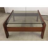 A square wood & glass coffee table.