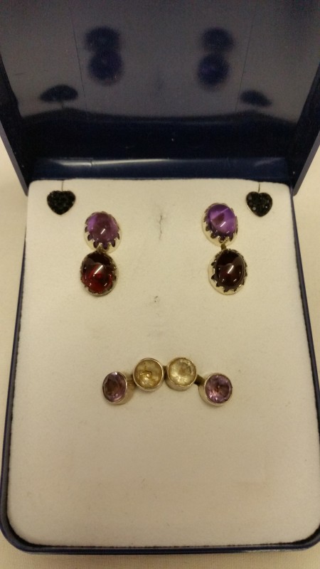 5 pairs of silver stud earrings.