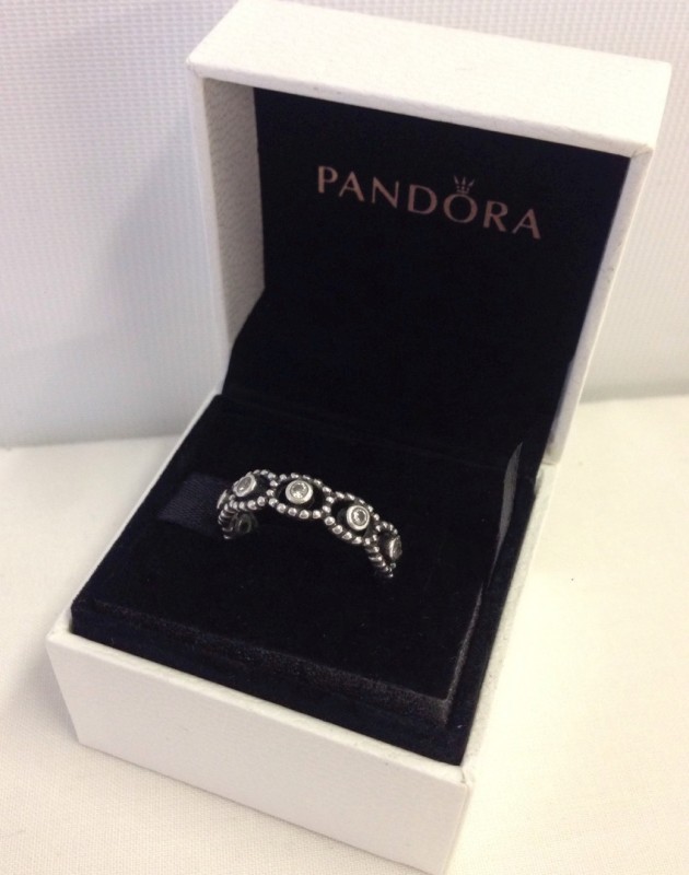 A Pandora "Romance" silver eternity ring.