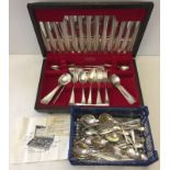A boxed canteen of Insignia plate cutlery together with a quantity of loose matching cutlery.