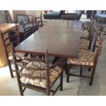 An extending oak dining room table and 8 chairs (6 + 2 carvers).