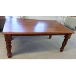 A large rubberwood dining table.