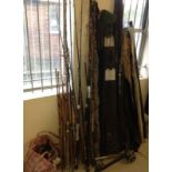 A large quantity of sea and course fishing rods and reels.