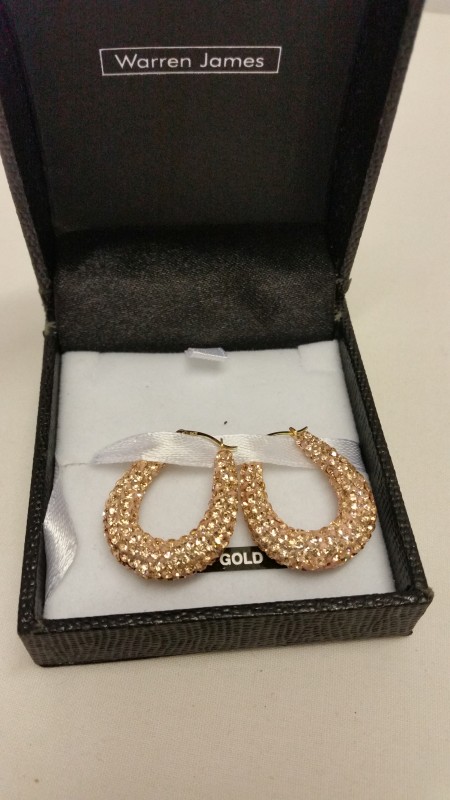 A pair of rose gold coloured crystal set drop hoop earrings with 9ct gold fixings.