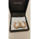 A pair of rose gold coloured crystal set drop hoop earrings with 9ct gold fixings.