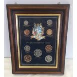 A framed and glazed pre decimal British coin set.