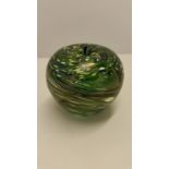 A green glass Ditchfield style apple shaped paperweight.