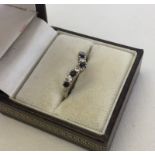 Silver wishbone ring set with sapphires and clear stones