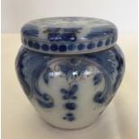 A late 19th/early 20th century blue & white tin glazed jar & cover.