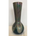 A long necked opalescent glass vase.