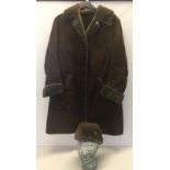 A ladies sheepskin brown coat with matching hat by Nurseys.