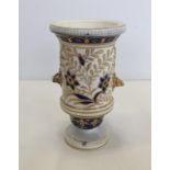 A small posy vase with stag's heads and blue & gilt decoration.