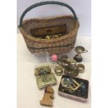 A wicker basket containing a good quantity of miscellaneous items.