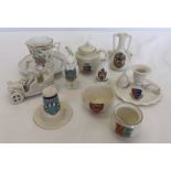 A quantity of ceramic crested ware items to include car, owl and candlestick.