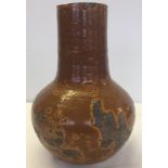 An 18th century or earlier Oriental long necked jar.