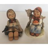 2 Goebel Hummel figurines of girls with headscarves.