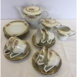 A yellow and floral 6 setting Noritake tea set.