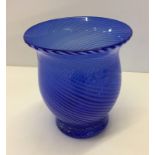 A blue swirl design, bulbous shaped, glass vase.