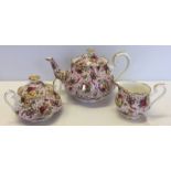 A Royal Albert Old country roses Ruby Celebration pink Chintz teapot, milk jug and sugar bowl.