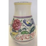 A large Poole pottery vase with floral design and signature "blue bird".