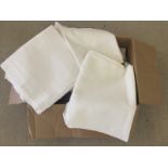 A large box of vintage white table linen.