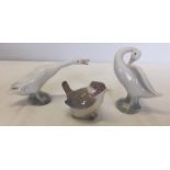 2 Lladro geese together with a Lladro crouching bird.