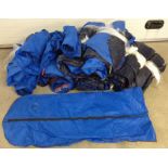 A large quantity of plastic suit & clothes protective covers.