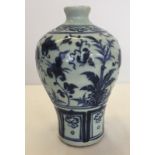 A blue and white Chinese heavy ceramic vase with hand painted decoration.