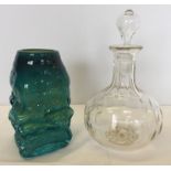 2 pieces of glass, a blue/green piece of studio glass together with a Victorian clear glass decanter