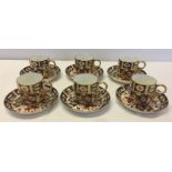 A set of 6 Royal Crown Derby Coffee cups and saucers. Dated 1899. Together with 6 coffee spoons.