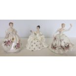 3 ceramic Royal Doulton Lady figures white colouration all with floral decoration.